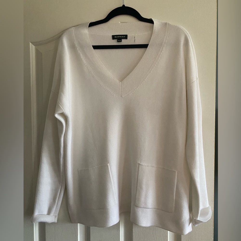 white Repeat brand sweater.